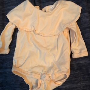 Like new. Worn once for pictures. Pale orange.